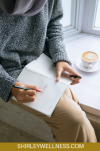 Woman sitting and writing