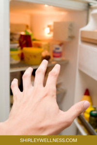 hand in fridge